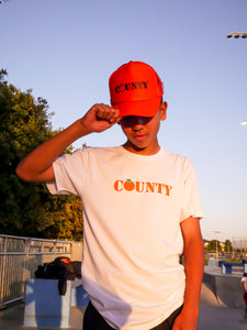 The County Trucker Hat: ORANGE